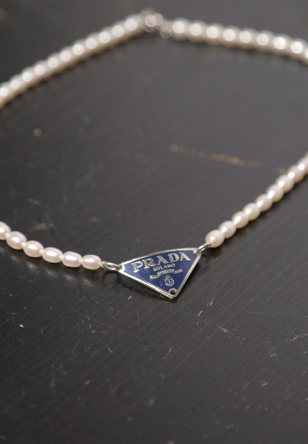 Prada mens necklace best sale